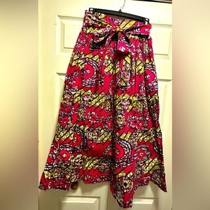 Women long skirt with pockets and belt. Elastic waist fits sizes SM & MED